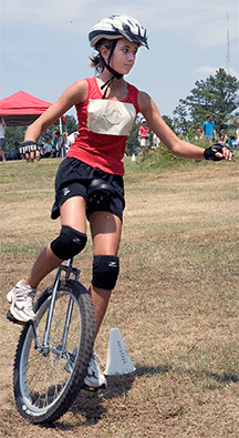 Unicycling girl makes turn