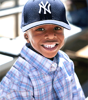 boy with yankees cap on